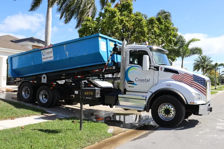 roll-off dumpster in driveway of home