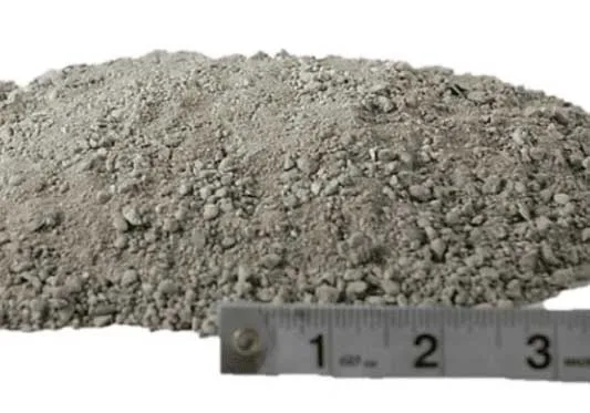 Quarter inch minus screenings recycled aggregate product — fine crushed material for paver base and leveling, shown with ruler for scale