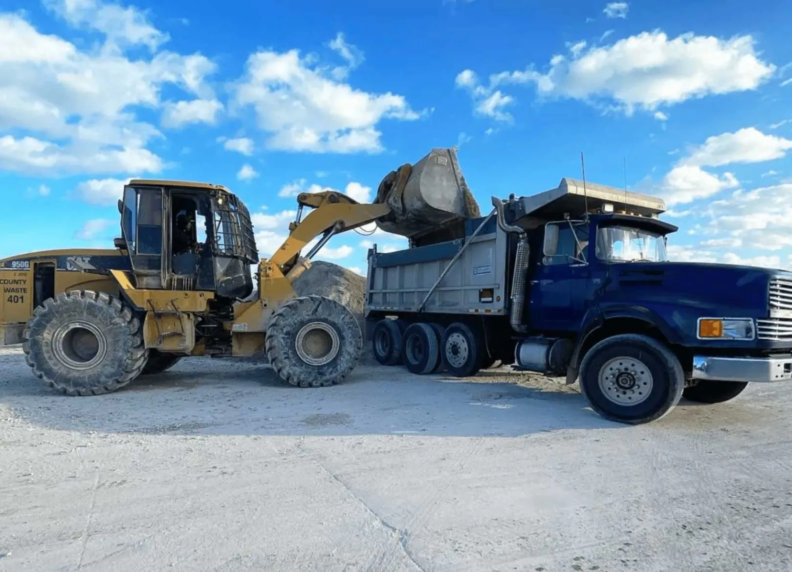 Front loader operating at Coastal Materials Management commercial scrap metal pickup site